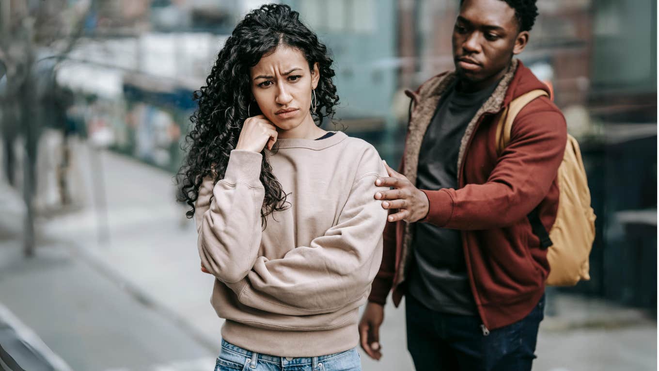 distressed woman being comforted by man