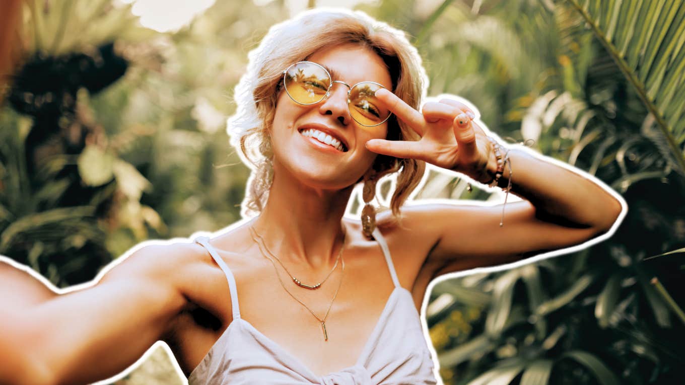 Useful Things to Do Instead of Comparing Yourself to Others happy woman taking a selfie