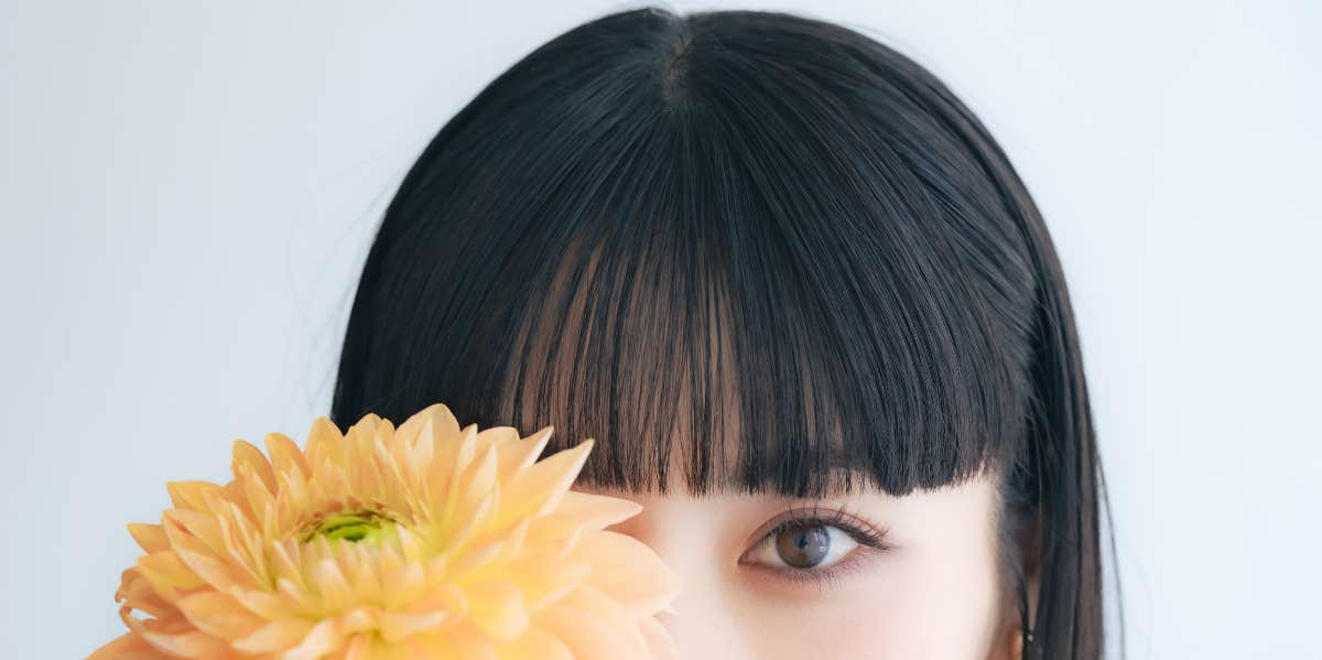 The Compliment That Has Shaken My Identity woman with flower