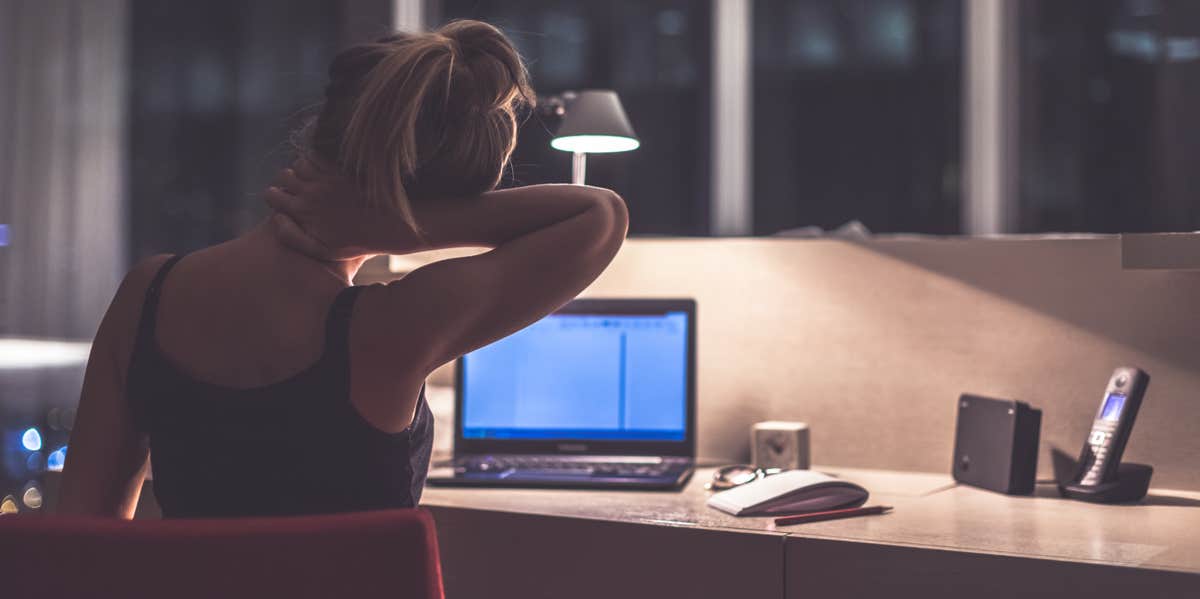 woman stressed at work desk