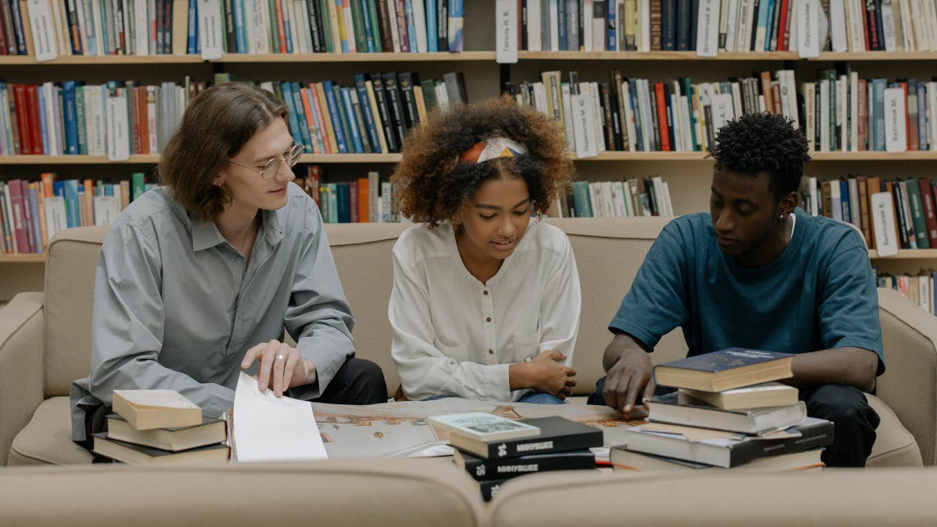 college students studying in library 