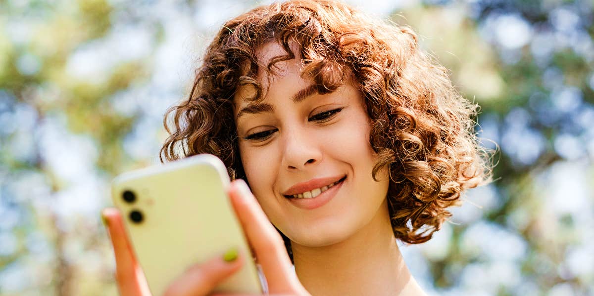 Woman checks her list of coping skills on her phone