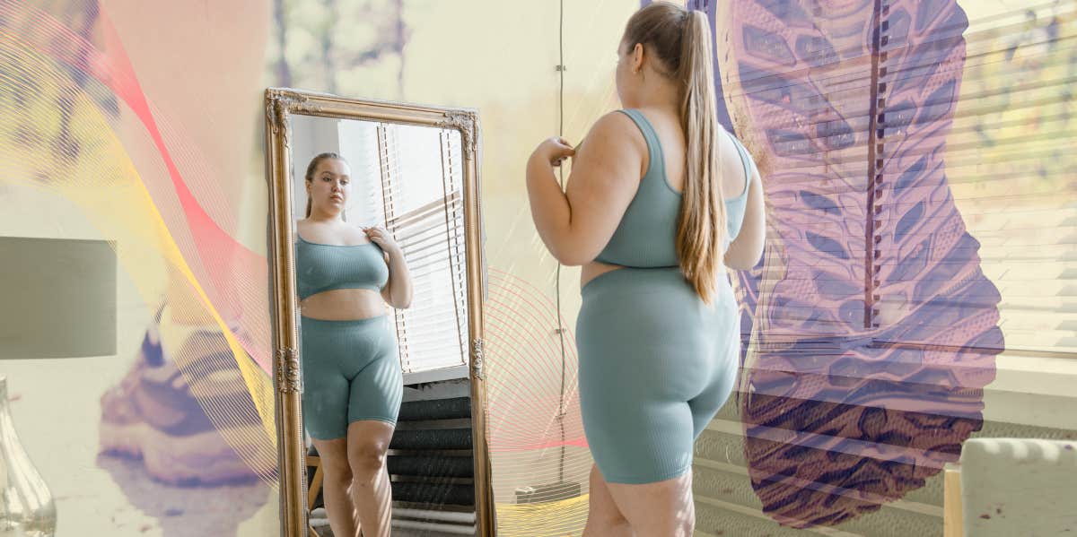 Woman looking at herself in the mirror