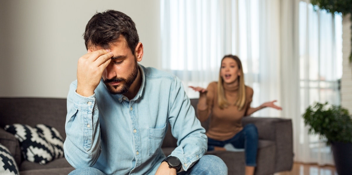 young couple arguing in house