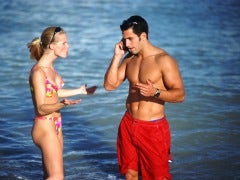 Couple arguing on the beach