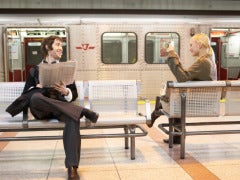 man and woman at a subway station