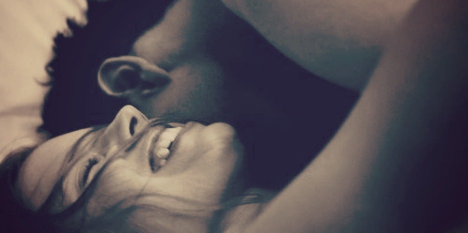 couple laying in bed together couple laying in bed together