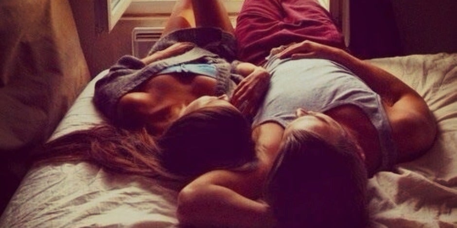 couple laying in bed couple laying in bed