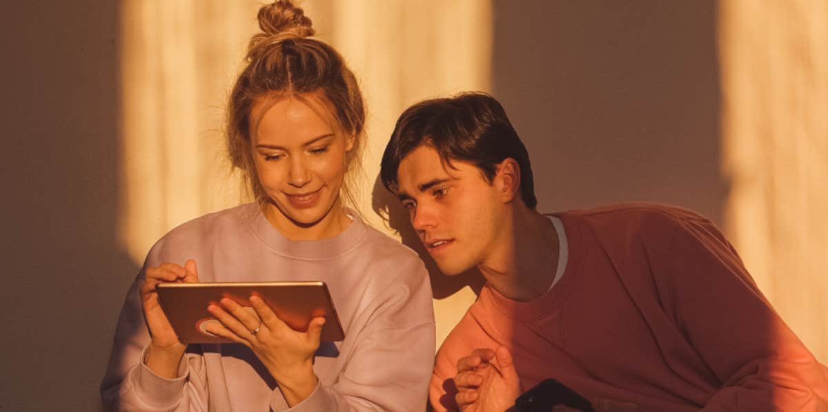 Couple looking at a tablet