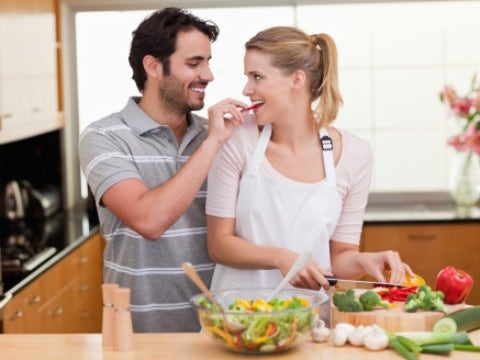 couple happy cooking