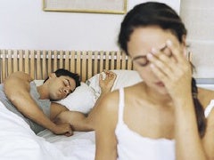 How To Handle Your One-Night Stand couple in bed man asleep woman with head in hand