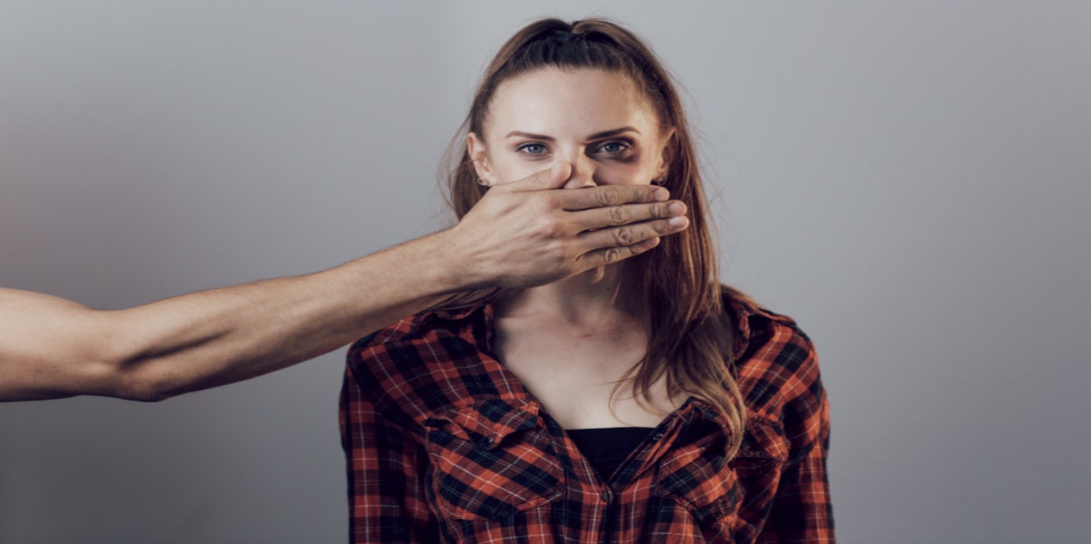 Man stopping woman from speaking