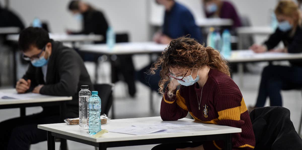Study Shows Covid-19 Recovery Could Mean Having A Lower IQ girl with mask at desk
