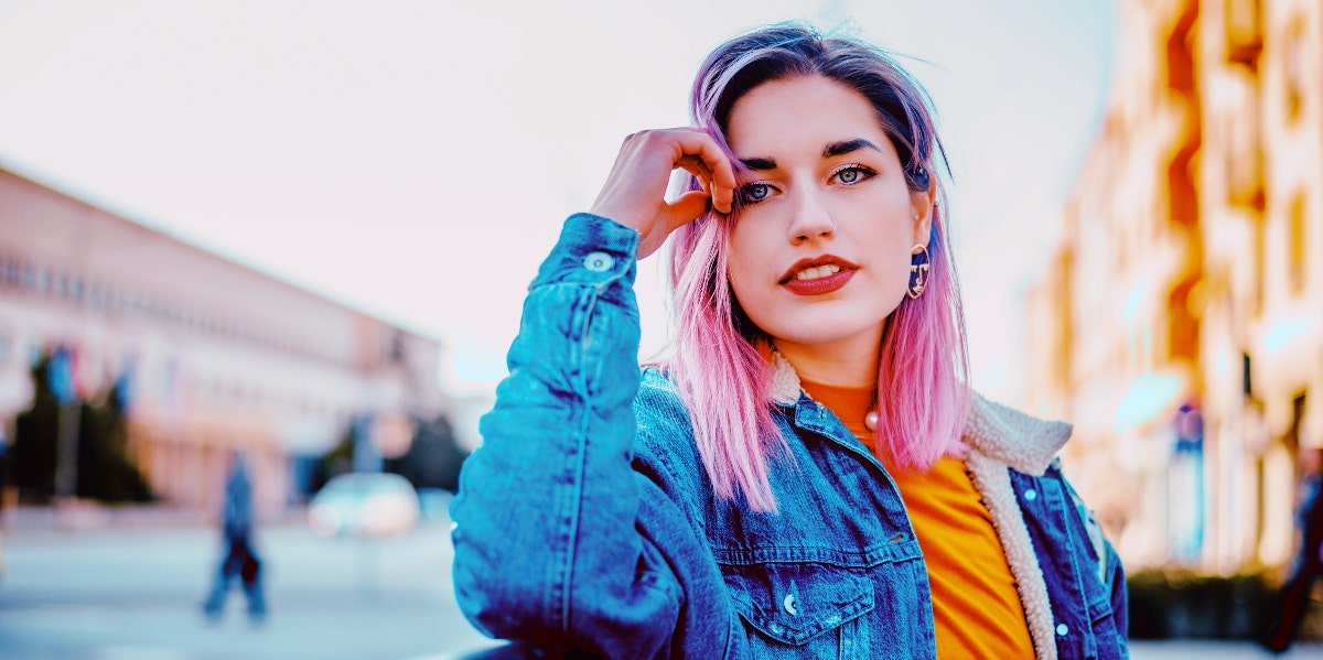 creating happiness smiling pink-haired woman