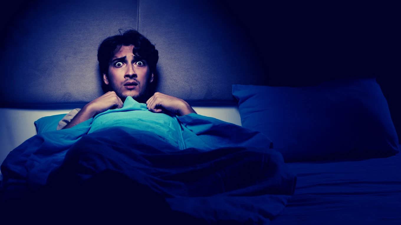 man in bed afraid