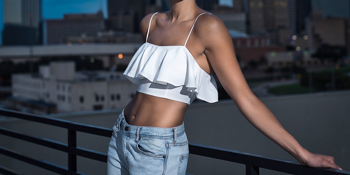 a woman in a crop top