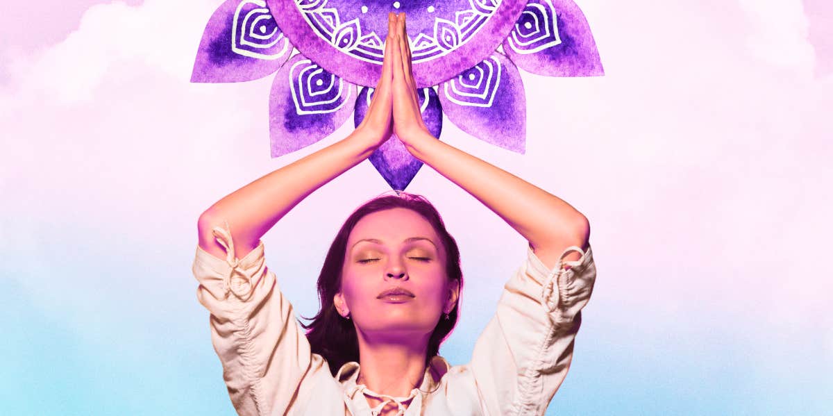 woman meditating with arms up