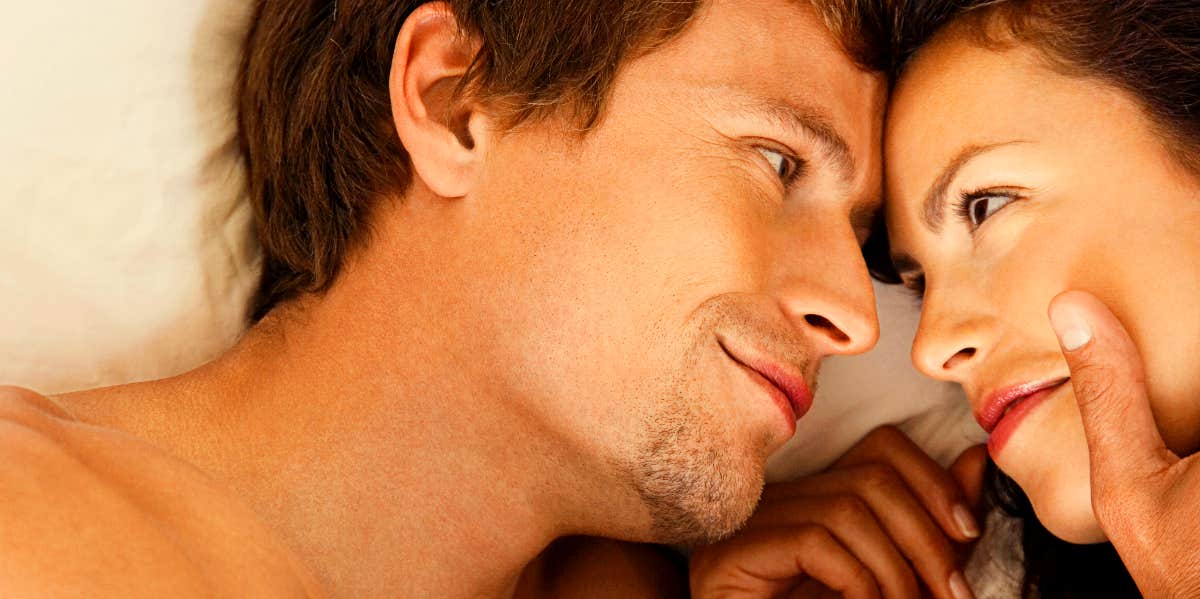 Cuddling after sex Man and woman showing affection