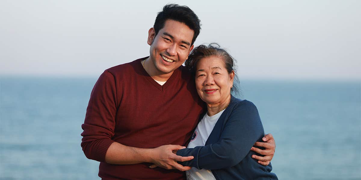 asian man hugging mother