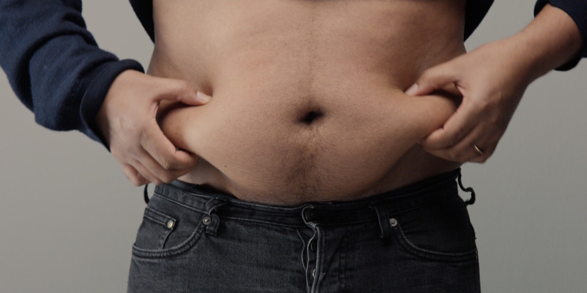 5 Reasons I'm 100 Percent Against The Dad Bod man holding belly fat