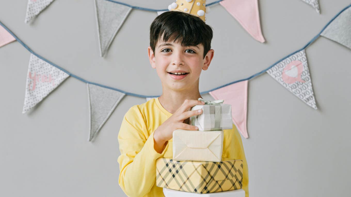 boy holding presents