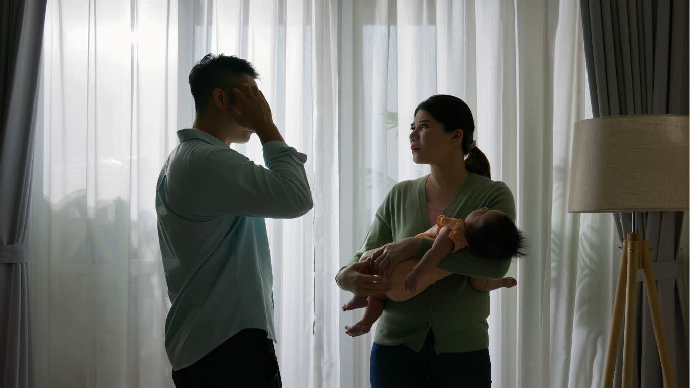 couple with baby arguing