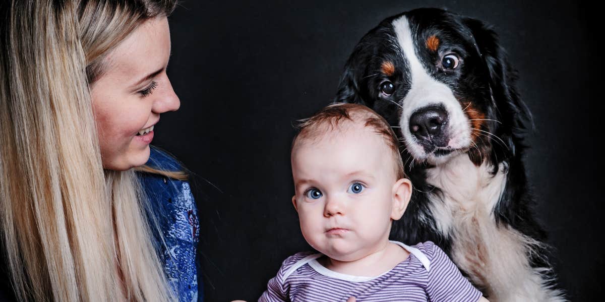 Young woman with baby and dog