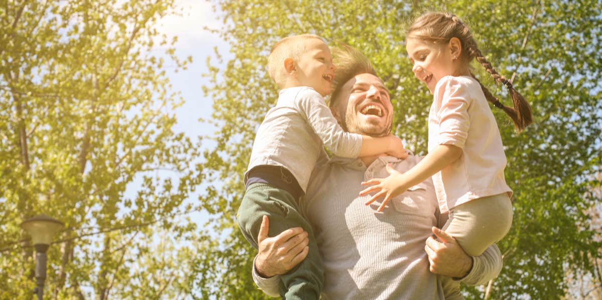 Dad with kids playing 