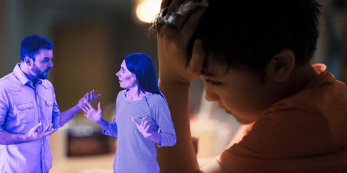 man and woman arguing over sad boy at dinner table