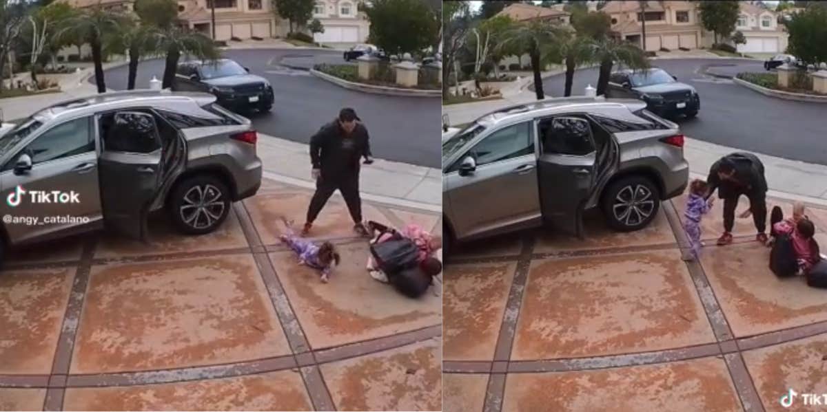 Dad Stands By While His Wife Unpacks Bags & Their Two Kids From The Car Before Tripping Over— 'Looks Like A Married Single Mom' Dad on phone mom unpacks car trips over kid