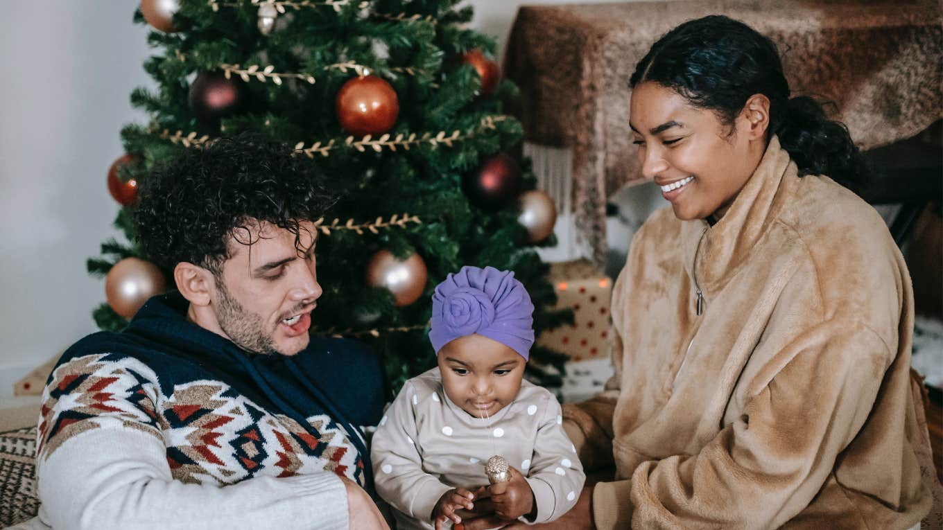 mom, dad and baby on Christmas