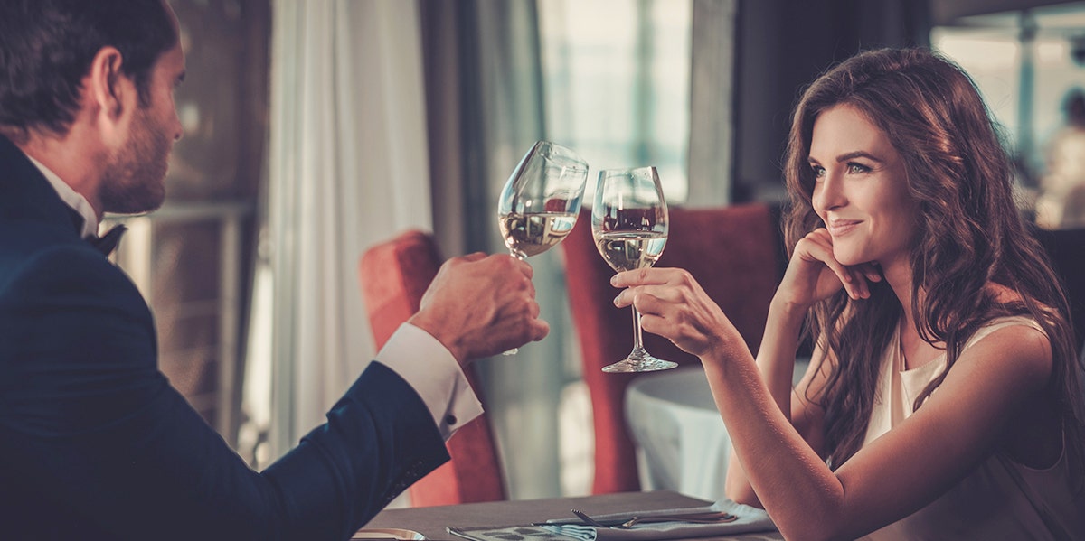 couple clinking their drinks together