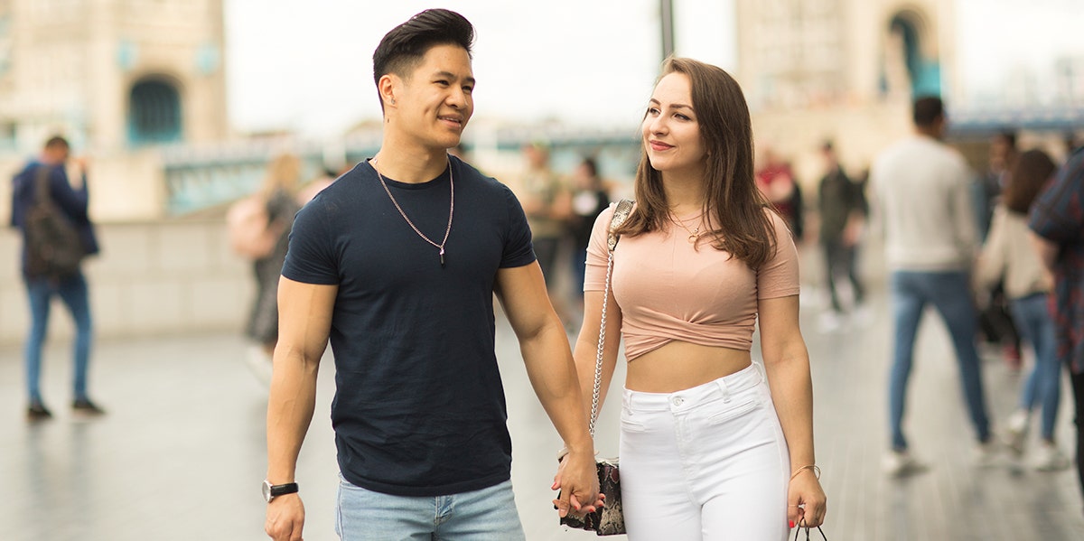 man and woman holding hands 