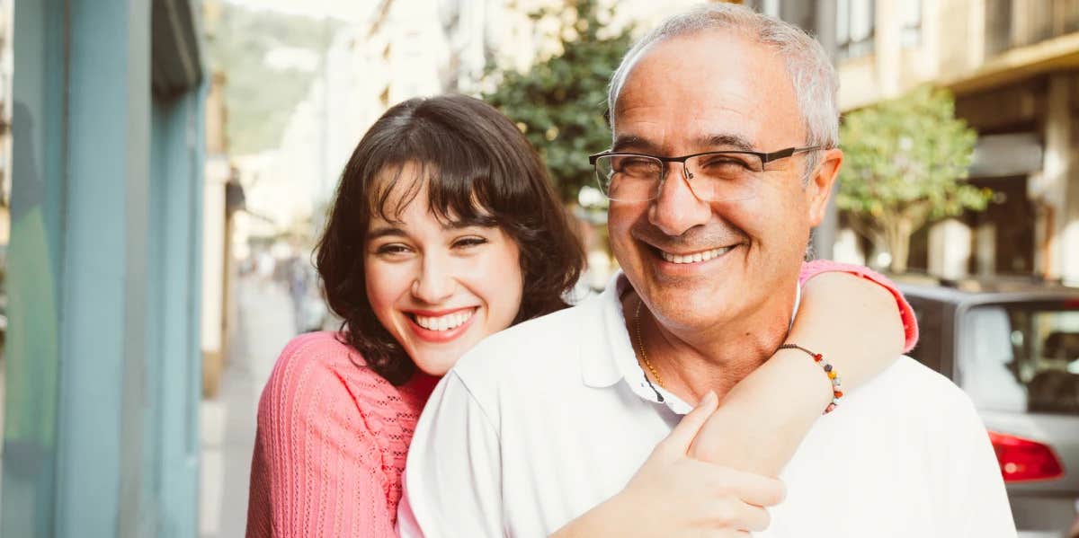 woman hugging father