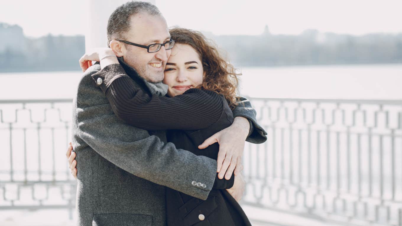 dad and daughter hugging