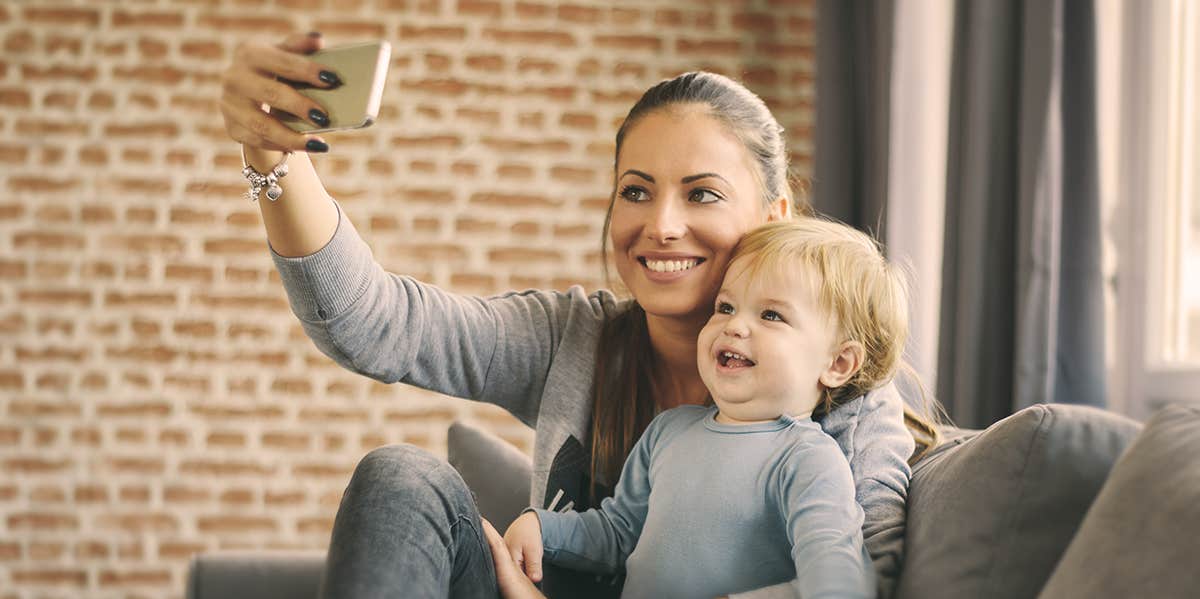 Moms: NOBODY Likes Your Baby Photos; They're Just Too Nice To Say So mom taking selfie with her child