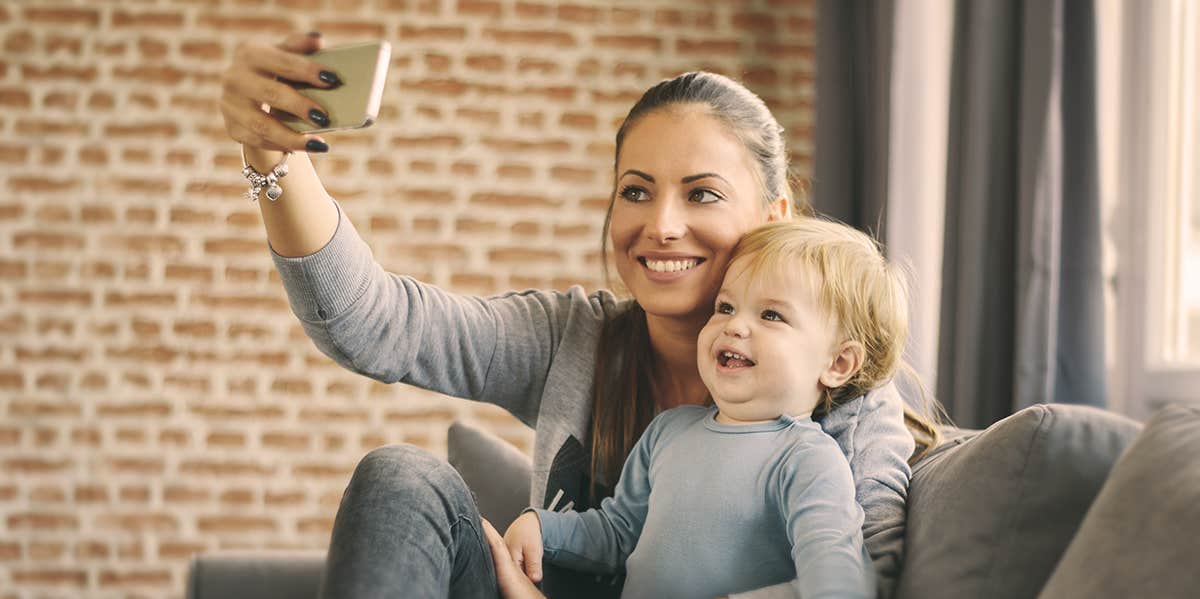 mom taking selfie with her child