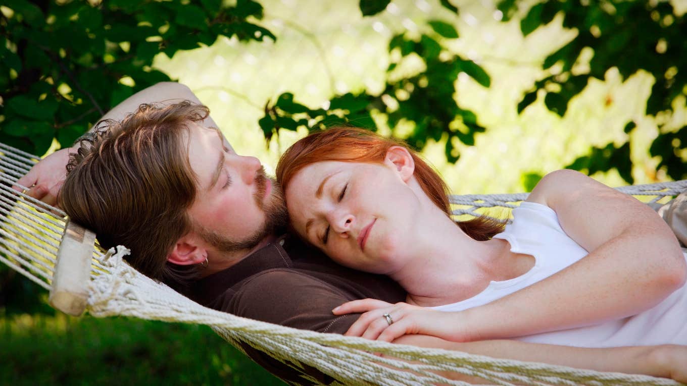 Husband and wife sleeping together 