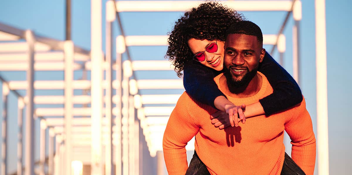 Ladies: If You Want A Better Love Life, Stop Being Passive man carrying woman on his back