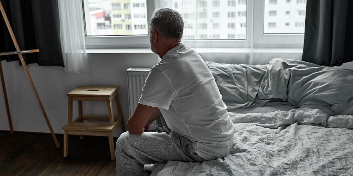 man sitting on deathbed