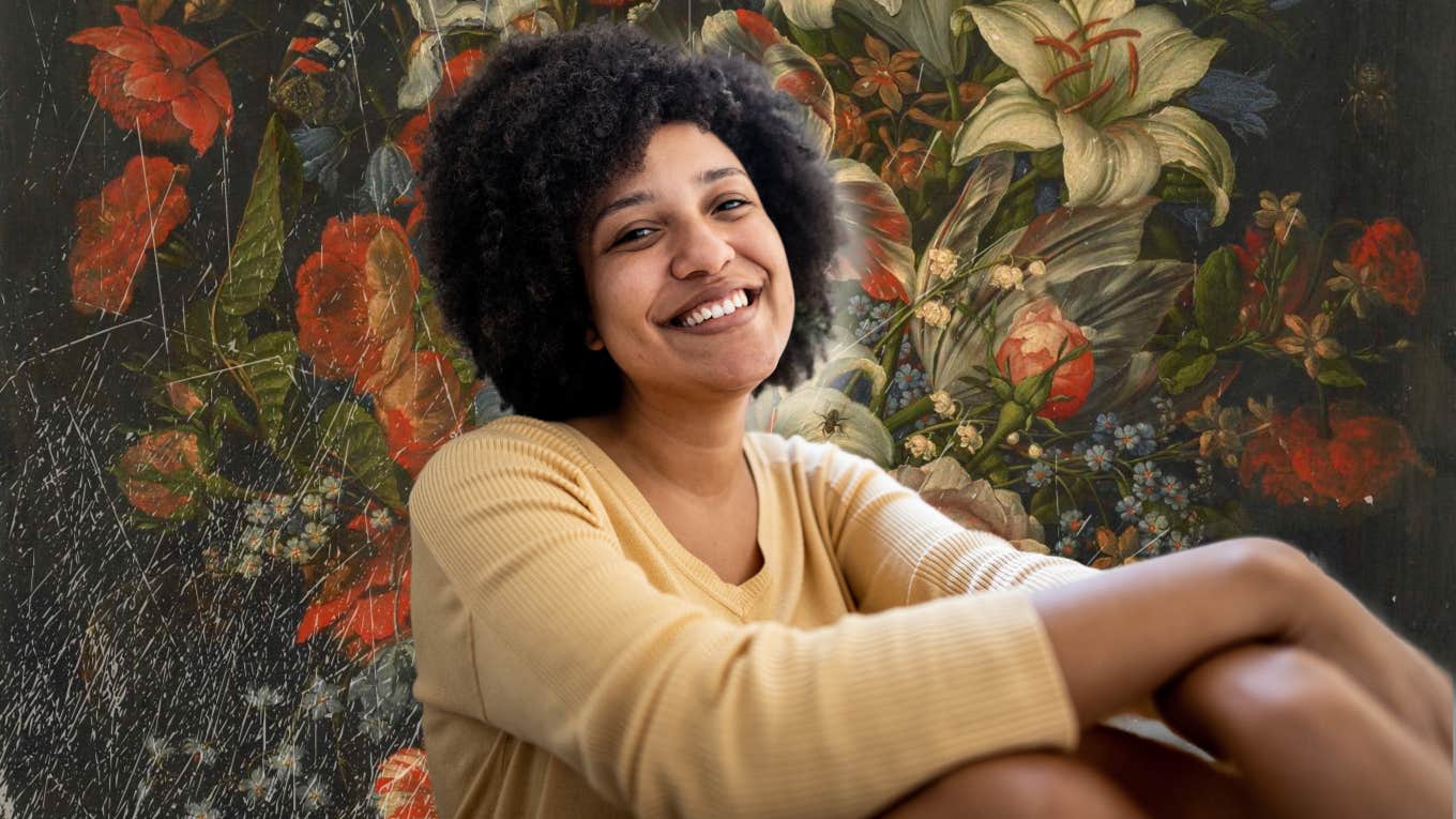 Woman sitting down with a smile