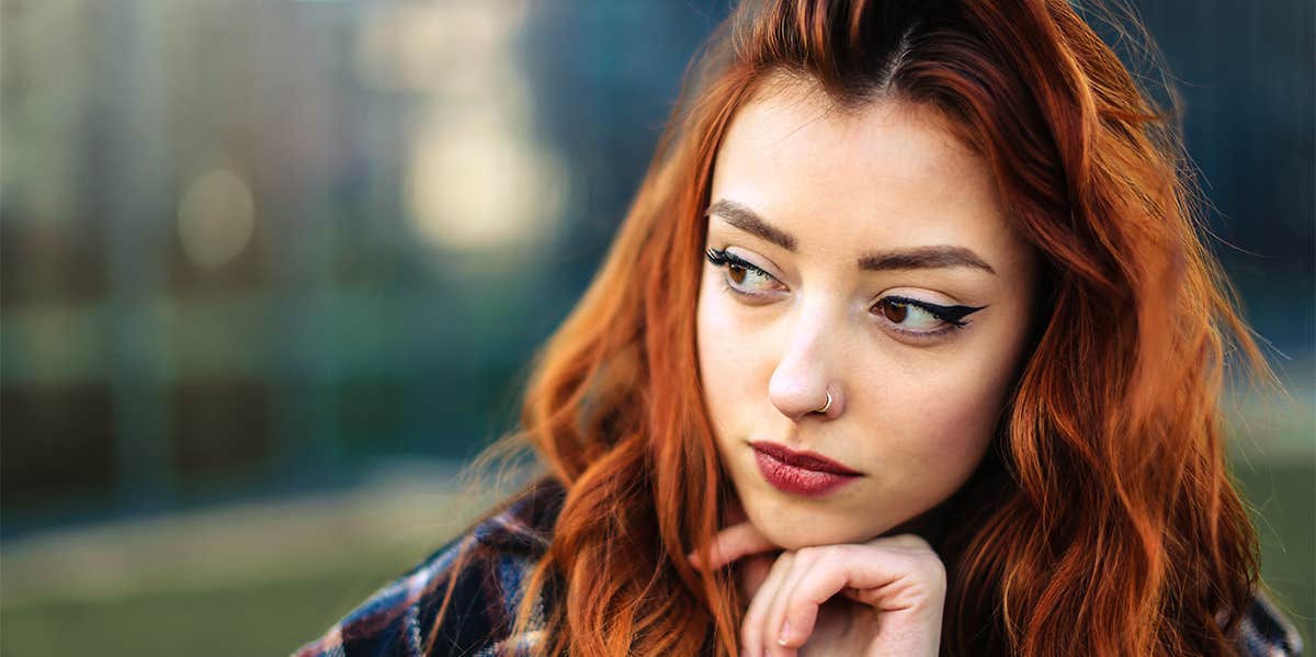 girl with red hair thinking