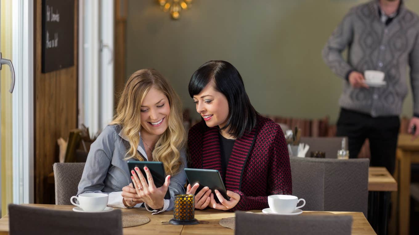 two young people interacting in a third place