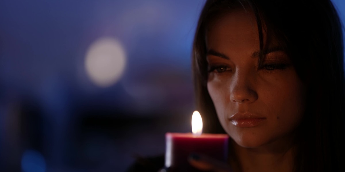 woman analyzing candle