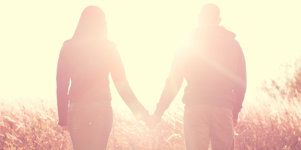 man and woman holding hands