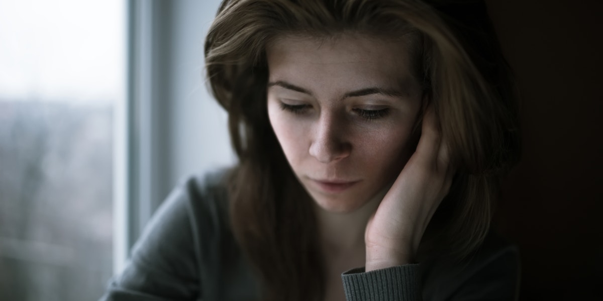 I didn't know it was rape. I thought I was being a good wife. sad woman