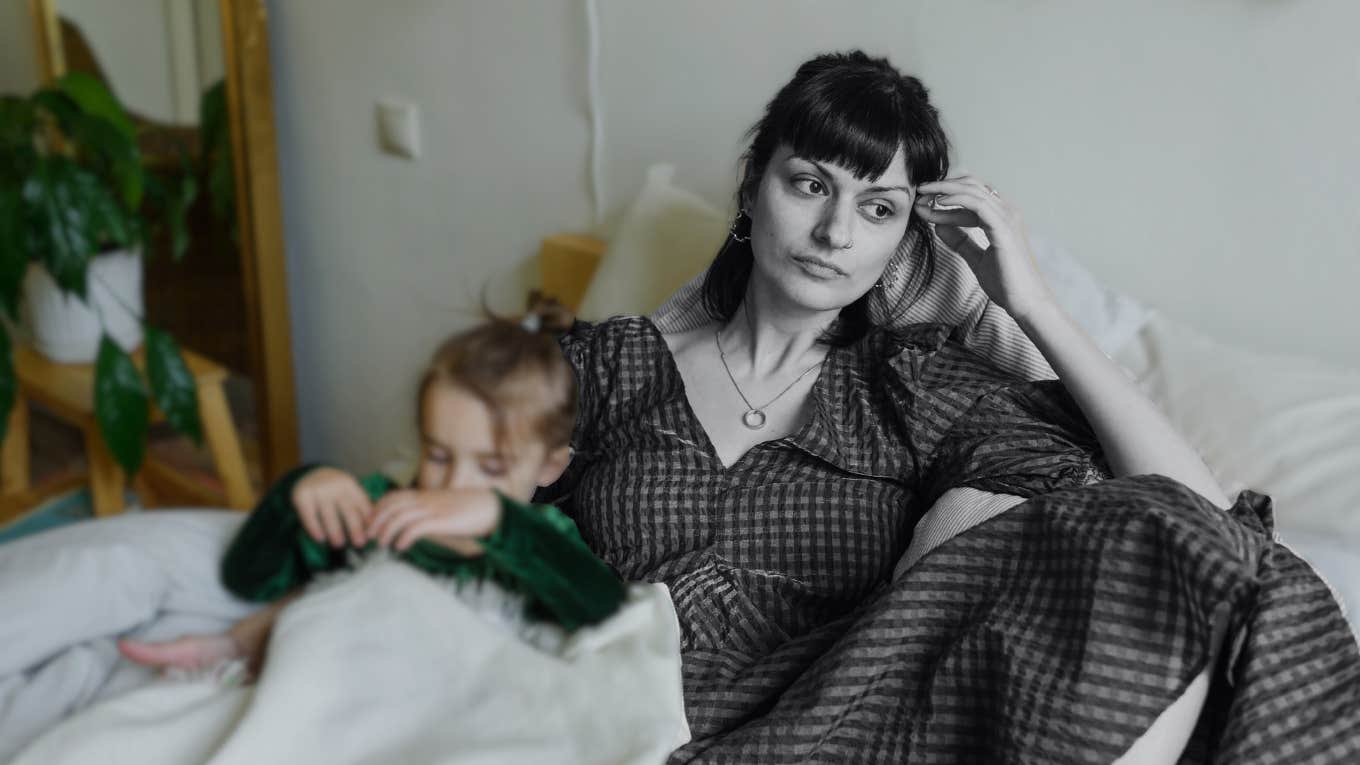 I Don't Like Being A Mom (Even Though Everyone Expected Me To) Woman zoning out, unhappy