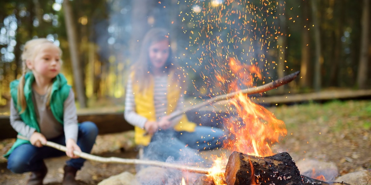 mom having campfire with kids