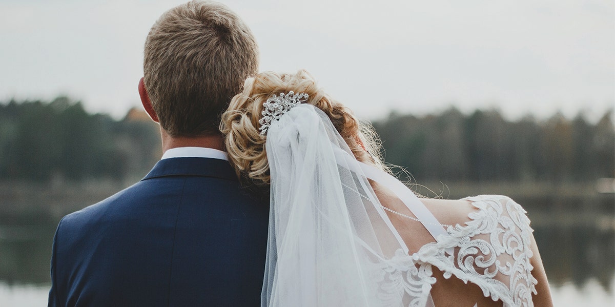 bride and groom facing away