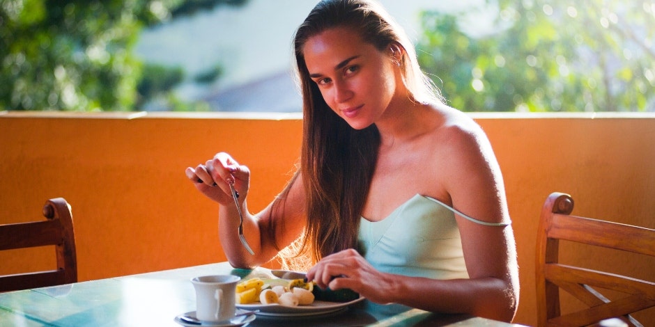 Woman eating fruit